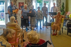 Audrey Merry (seated right) celebrating her 100th birthday at the Skylark home in Horsham. Roger had written a special tribute, 'Happy Birthday Sweet Audrey', which we sang to a familiar Neil Sedaka tune